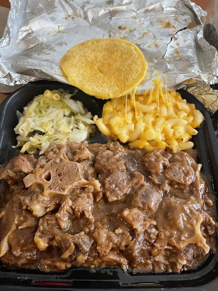 Oxtail over Rice Cabbage Mac and Cheese with Corn Bread